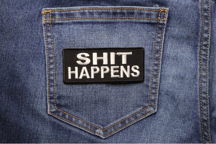 Shit Happens Patch shown on jeans