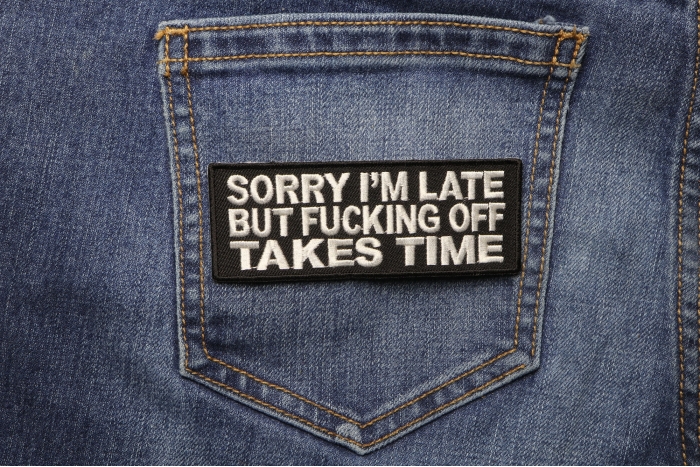 Sorry I'm Late But Fucking Off Takes Time Patch shown on jeans