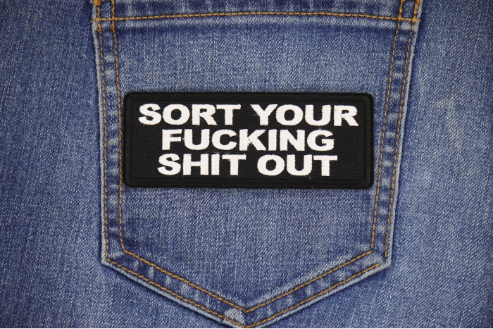 Sort Your Fucking Shit Out Patch shown on jeans