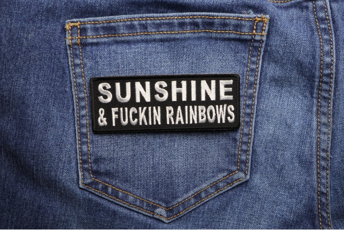 Sunshine and Fuckin Rainbows Patch shown on jeans