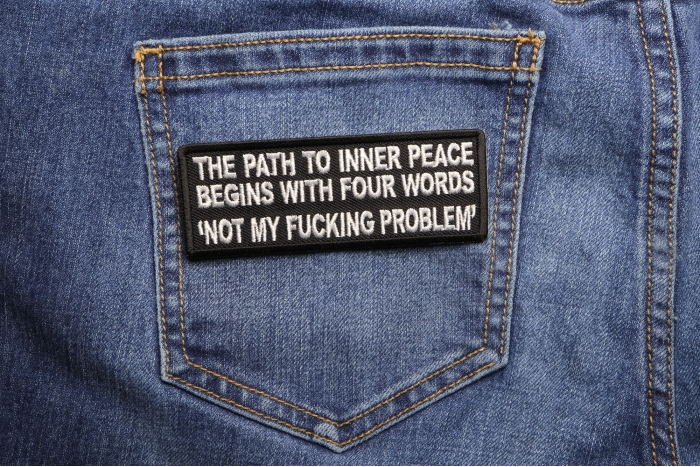 The Path To Inner Peace Begins with Four Words Not My Fucking Problem Patch shown on jeans