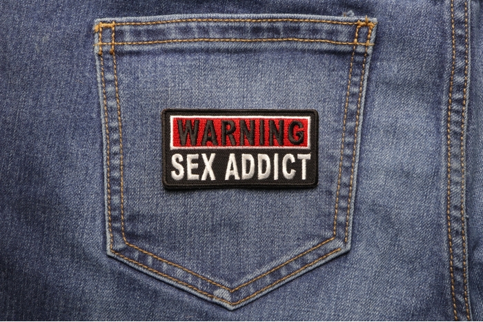 Warning Sex Addict Patch shown on jeans