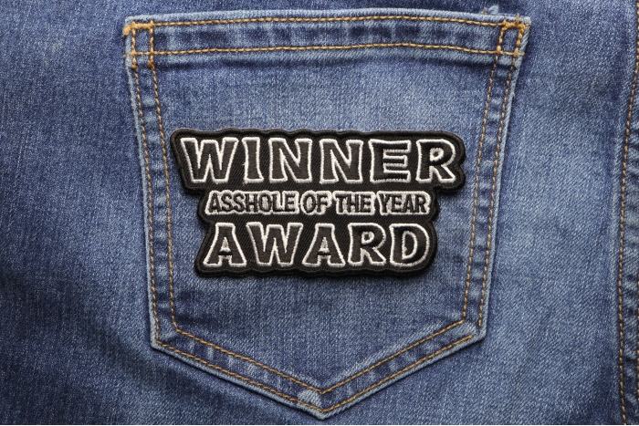 Winner Asshole Of The Year Award Patch shown on jeans