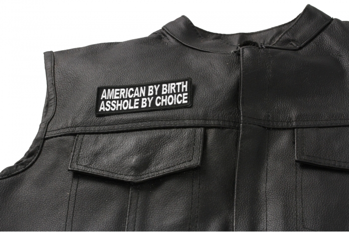American by Birth Asshole by Choice Patch - 4x1.5 inch. Embroidered Iron on Patch shown on leather vest