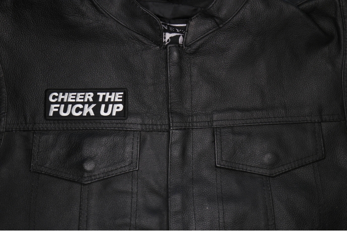 Cheer The Fuck Up Patch shown on leather vest