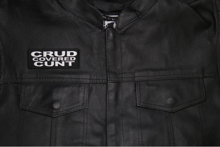Crud Covered Cunt Patch shown on leather vest
