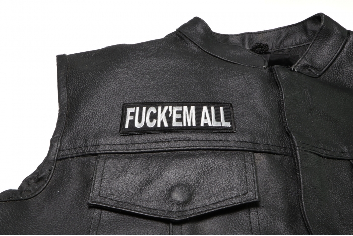 Fuck'em All Patch - 4x1.5 inch. Embroidered Iron on Patch shown on leather vest