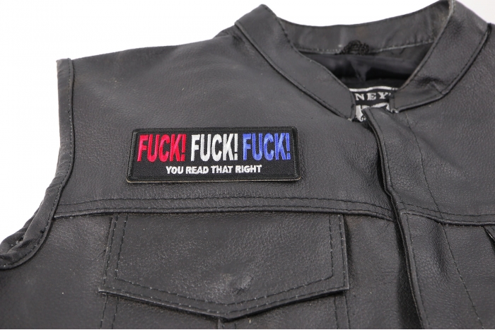 Fuck Fuck Fuck You Read That Right Patch - 4x1.5 inch. Embroidered Iron on Patch shown on leather vest
