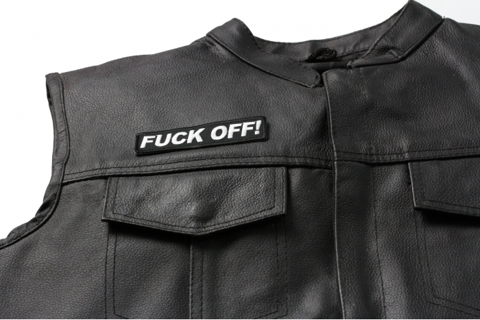 Fuck Off Patch - 4x1 inch. Embroidered Iron on Patch shown on leather vest