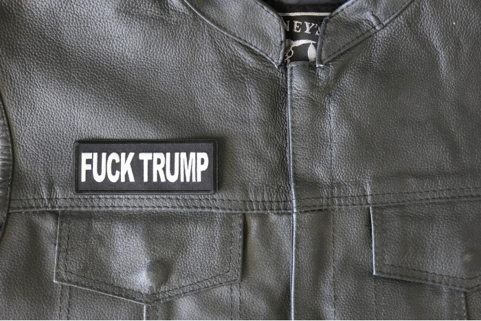 Fuck Trump Patch - 4x1.5 inch - Embroidered Iron on Patch shown on leather vest