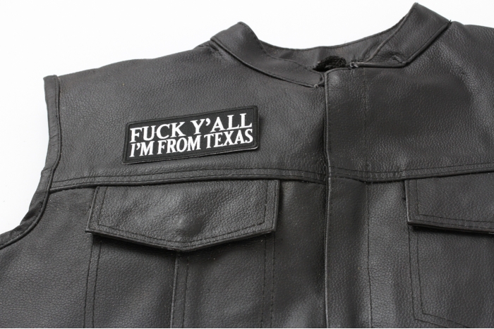 Fuck Y'All I'm From Texas Patch - 4x1.75 inch. Embroidered Iron on Patch shown on leather vest