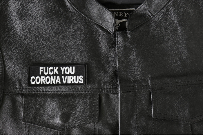 Fuck The Virus - 4x1.5 inch - Embroidered Iron on Patch shown on leather vest