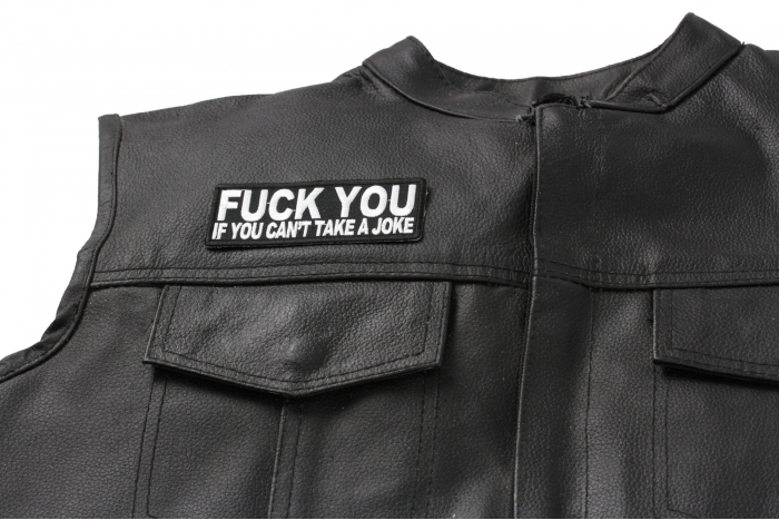 Fuck You If You Can't Take A Joke Patch - 4x1.5 inch. Embroidered Iron on Patch shown on leather vest