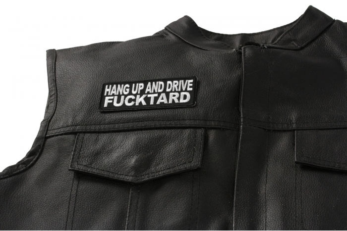 Hang Up and Drive Fucktard Patch - 4x1.5 inch. Embroidered Iron on Patch shown on leather vest