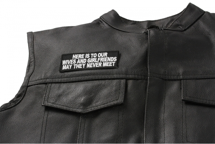 Here Is To Our Wives and Girlfriends Patch, Funny Saying Patches shown on leather vest