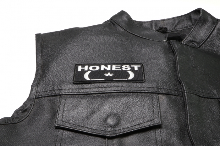 Honest Asshole Patch Emoticon - Iron on Patch - 4x1.5 inch shown on leather vest