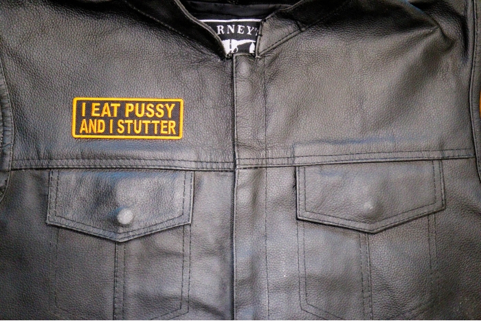 I Eat Pussy and I Stutter Patch, Funny Patches for Adults shown on leather vest