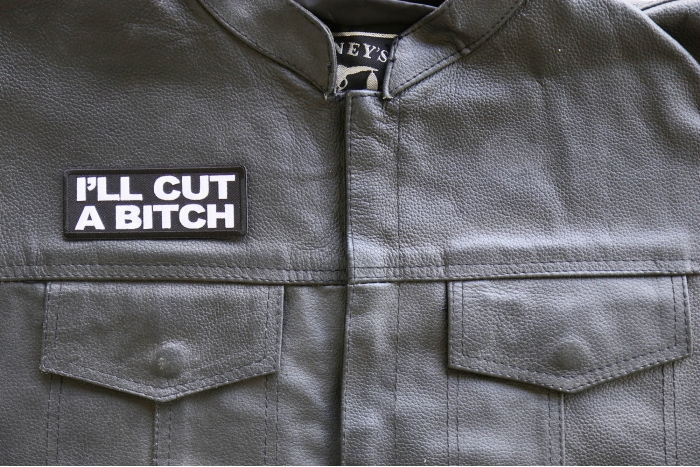 I'll Cut a Bitch Iron on Patch shown on leather vest