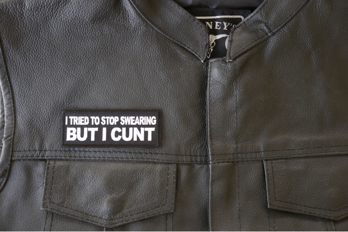 I Tried to Stop Cursing But I Cunt Patch - 4x1.5 inch. Embroidered Iron on Patch shown on leather vest