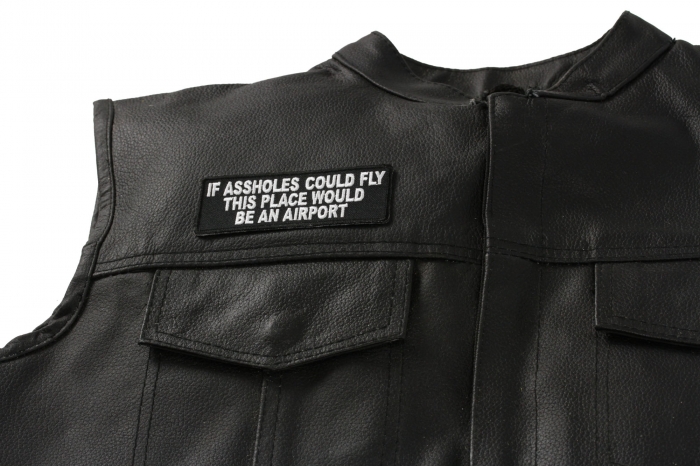 If Assholes Could Fly This Place Would Be An Airport Funny Patch - 4x1.5 inch. Embroidered Iron on Patch shown on leather vest