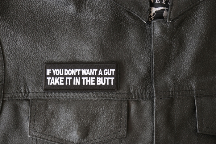 If You Don't Want a Gut Take it in The Butt Patch - 4x1.5 inch - Embroidered Iron on Patch shown on leather vest