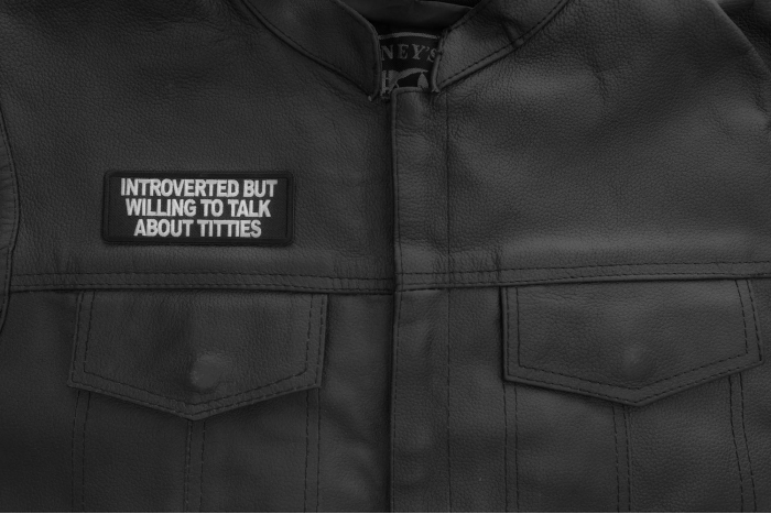 Introverted but willing to talk about titties patch shown on leather vest
