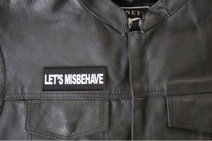 Let's Misbehave Patch - 4x1.5 inch - Embroidered Iron on Patch shown on leather vest