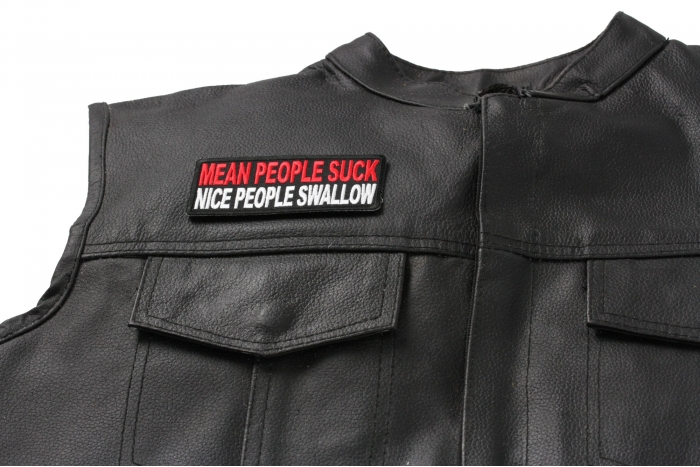 Mean People Suck Nice People Swallow Patch - 4x1.5 inch. Embroidered Iron on Patch shown on leather vest