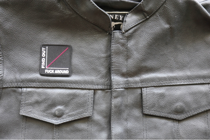 More You Fuck Around More You Find Out Patch, Biker Sayings shown on leather vest