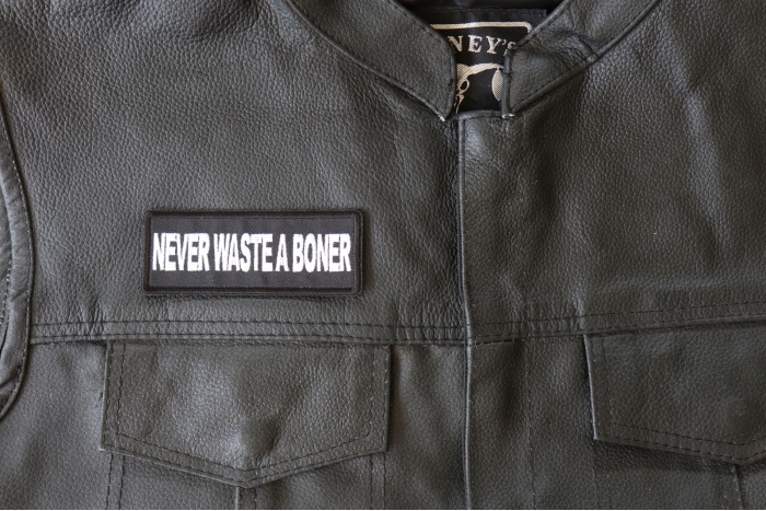 Never Waste a Boner Patch - 4x1.5 inch - Embroidered Iron on Patch shown on leather vest