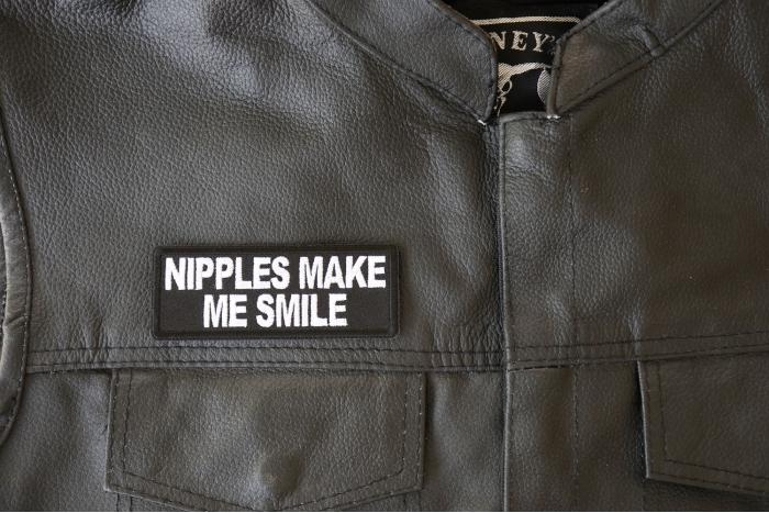 Nipples Make Me Smile Patch, Funny Patches for Adults shown on leather vest
