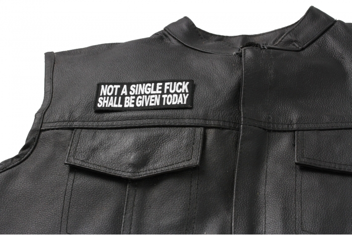 Not A Single Fuck Shall Be Given Today Patch - 4x1.5 inch. Embroidered Iron on Patch shown on leather vest