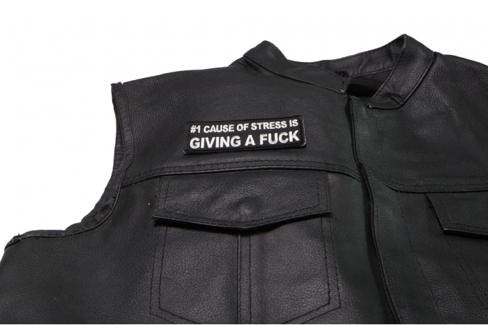 Number 1 Cause of Stress is Giving a Fuck Patch - 4x1.5 inch. Embroidered Iron on Patch shown on leather vest
