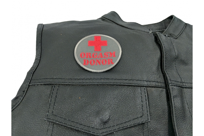 Orgasm Donor Patch - 3 inch. Embroidered Iron on Patch shown on leather vest
