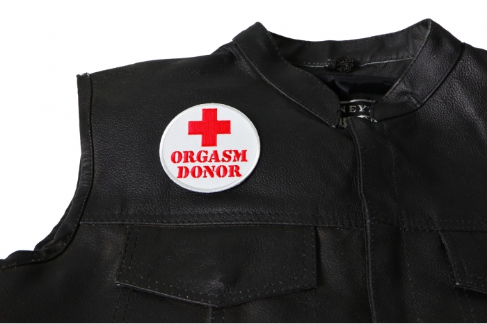 Orgasm Donor Red Cross Patch - 3x3 inch. Embroidered Iron on Patch shown on leather vest