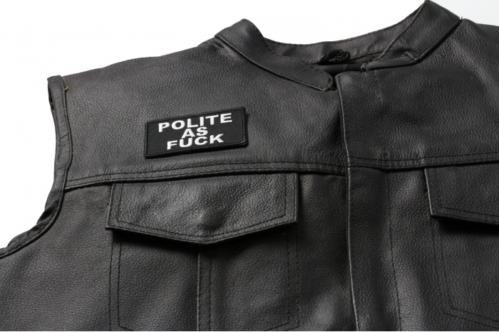 Polite As Fuck Funny Patch - 3.75x1.5 inch. Embroidered Iron on Patch shown on leather vest