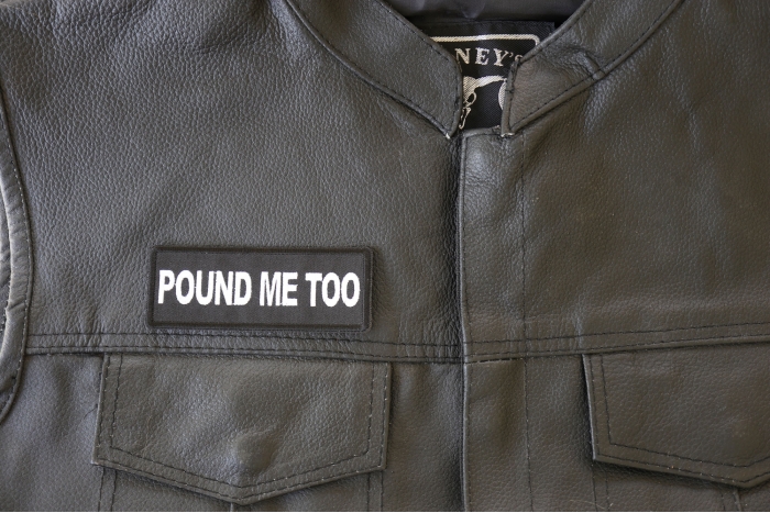Pound Me Too Patch - 4x1.5 inch. Embroidered Iron on Patch shown on leather vest