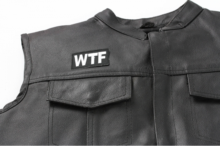 WTF Patch - 2.5x1.5 in. Embroidered Iron on Patch shown on leather vest