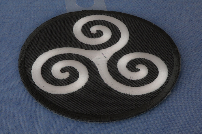 Karma Symbol Iron on Novelty Patch diagonal view