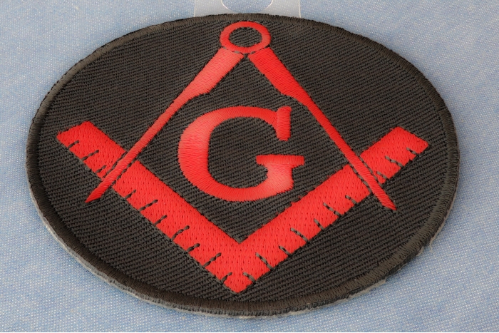 Mason Symbol Novelty Iron on Patch In Red diagonal view