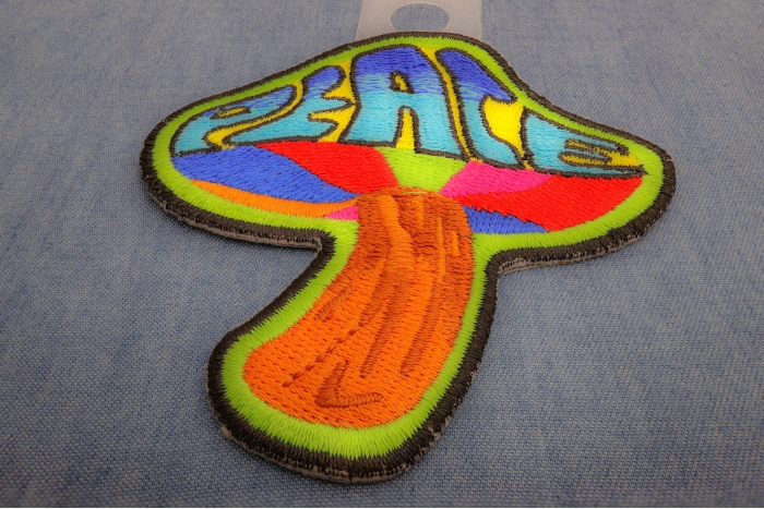 Peace Mushroom Novelty Iron on Patch Psychedelic Hippie diagonal view