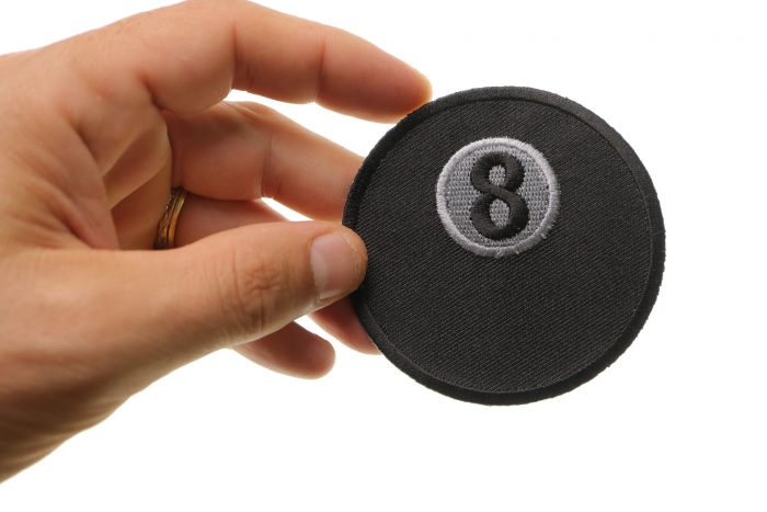 8 Ball Novelty Iron on Patch shown on hand for size comparison