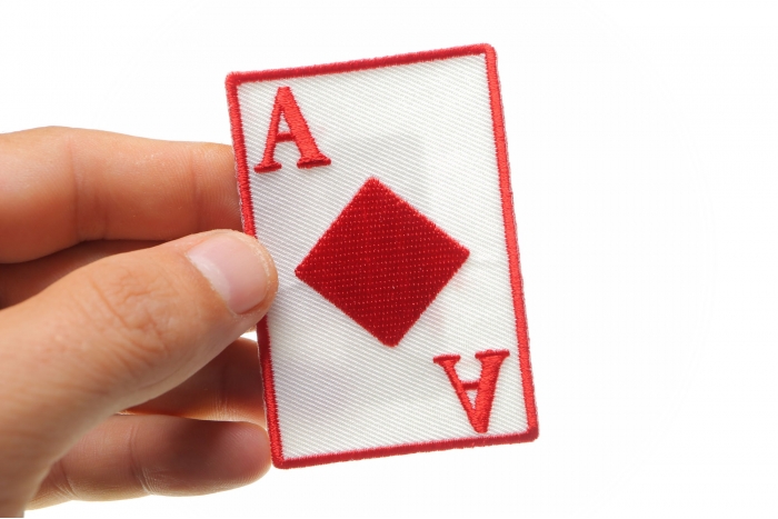 Ace Of Diamonds Novelty Iron on Patch shown on hand for size comparison