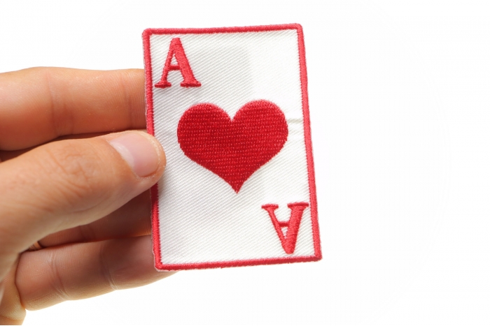 Ace Of Hearts Novelty Iron on Patch shown on hand for size comparison