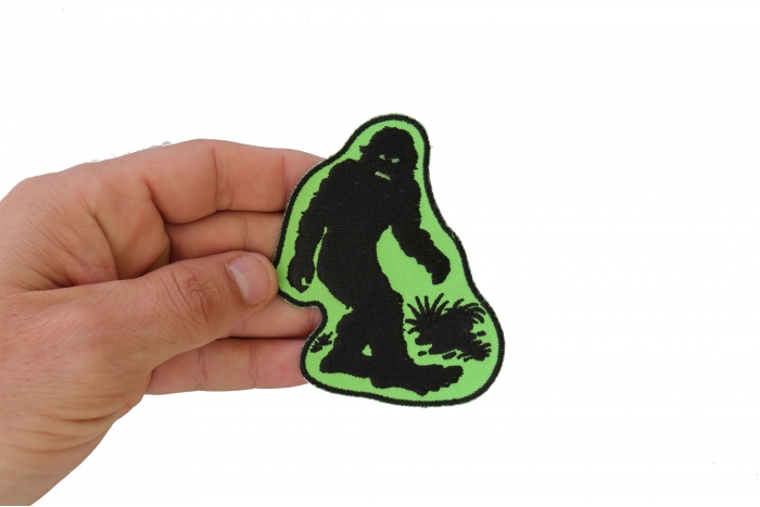 Big foot Sasquatch Novelty Iron on Patch shown on hand for size comparison