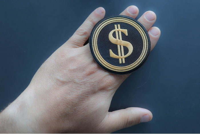 DOGE Department Of Government Efficiency DOLLAR Sign Patch shown on hand for size comparison