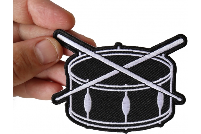 Drum and Sticks Music Band Iron on Novelty Patch shown on hand for size comparison