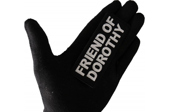 Friend of Dorothy Funny Iron on Patch shown on hand for size comparison