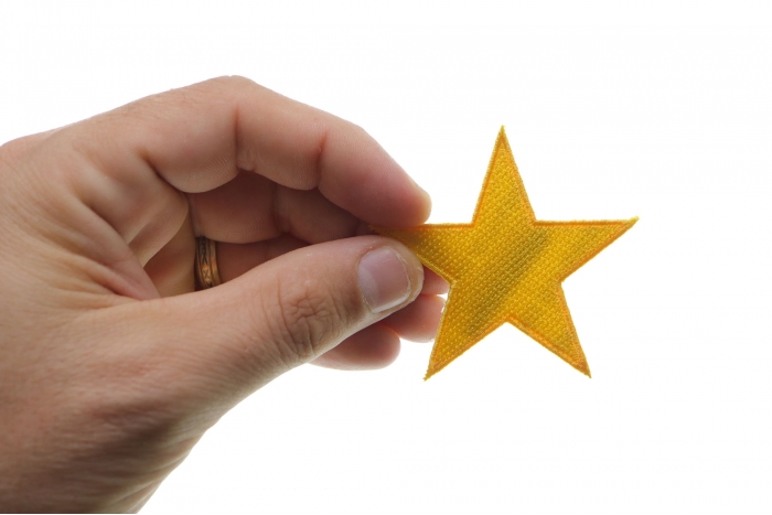 Gold Star Patch, Iron on Patches shown on hand for size comparison