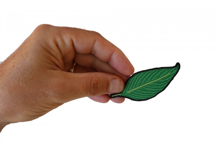 Green Leaf Patch shown on hand for size comparison